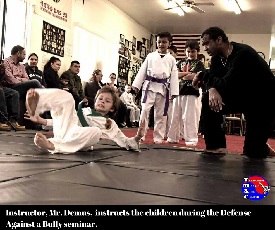 Instructor Mr. Demus teaches children during the Defense Against a Bully seminar.